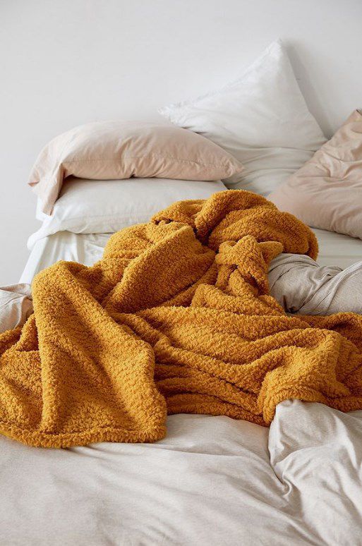 Get cozy with this golden fleece throw